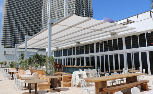En-Fold® retractable awning for commercial building