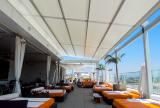 Retractable awning at Andaz Hotel | Roll-up curtains